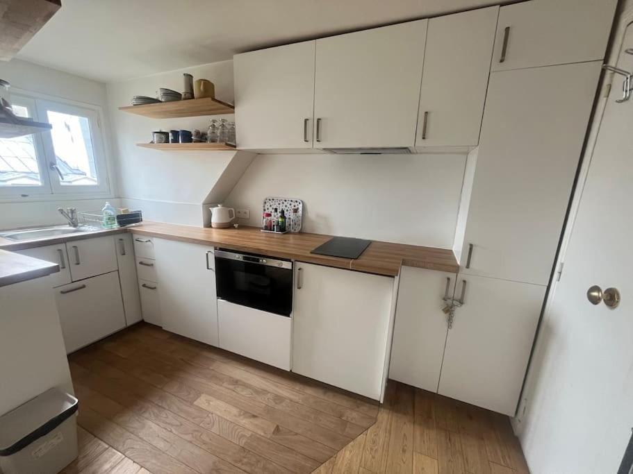 Cosy Sur La Festive Rue Du Fbg Saint-denis Apartment